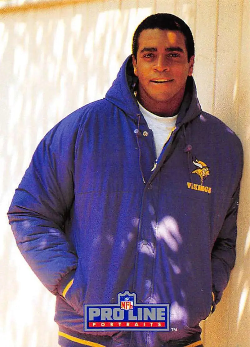 Person in royal blue Minnesota Vikings Pro Line jacket, featuring Ahmad Rashad design