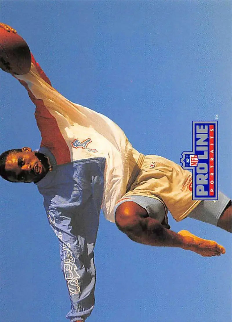 Martial artist performs high spinning kick under blue sky, Pro Line Portraits featuring Ernest Givins