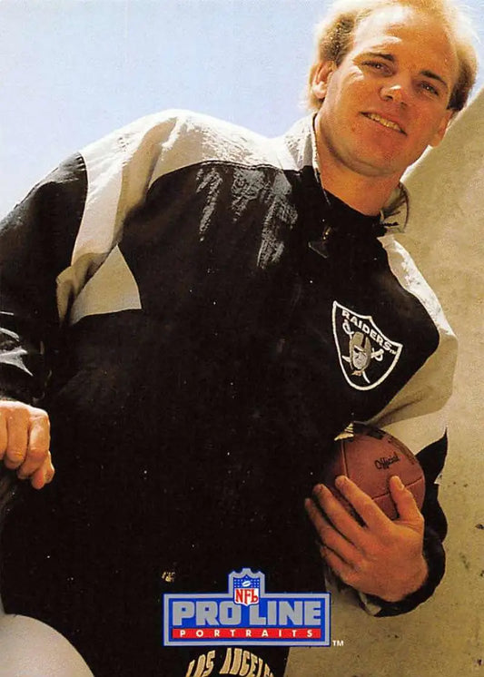 Black and white Los Angeles Raiders jacket featuring Jay Schroeder logo displayed