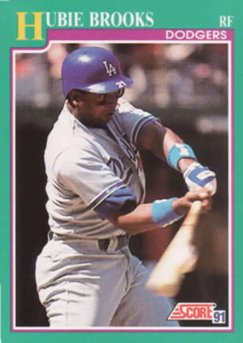 Baseball card of Los Angeles Dodgers player Hubie Brooks in gray road uniform swinging