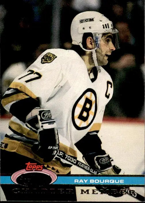 Hockey player in white Boston Bruins jersey 77 with captain’s C, Ray Bourque card