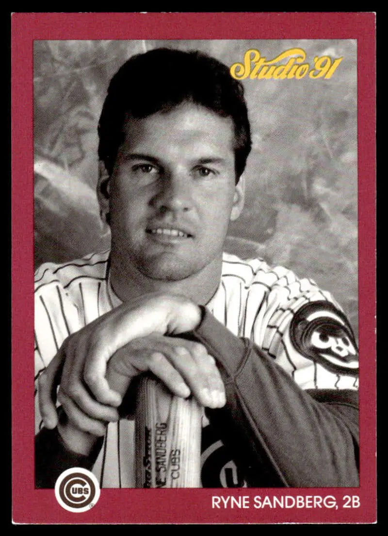 Ryne Sandberg Chicago Cubs Baseball Card in pinstripes leaning on a bat