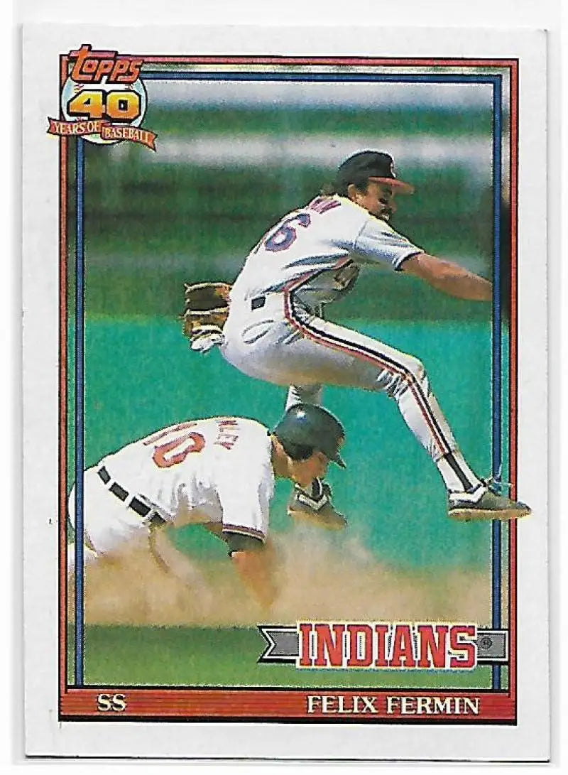 Felix Fermin leaps over a baserunner on this Cleveland Indians baseball card