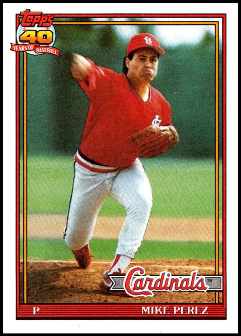 Baseball card of Mike Perez NM-MT in red uniform pitching for St. Louis Cardinals