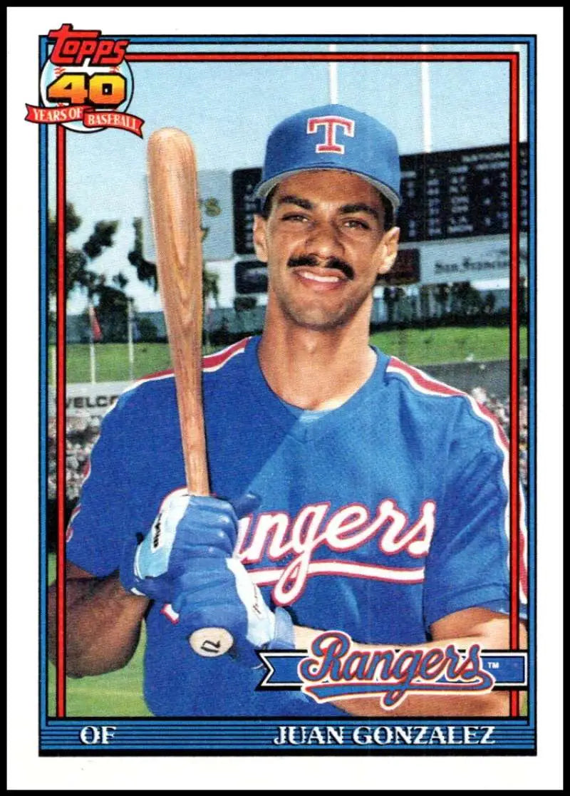 Juan Gonzalez Texas Rangers baseball card in blue uniform holding bat, 1991 Topps #224