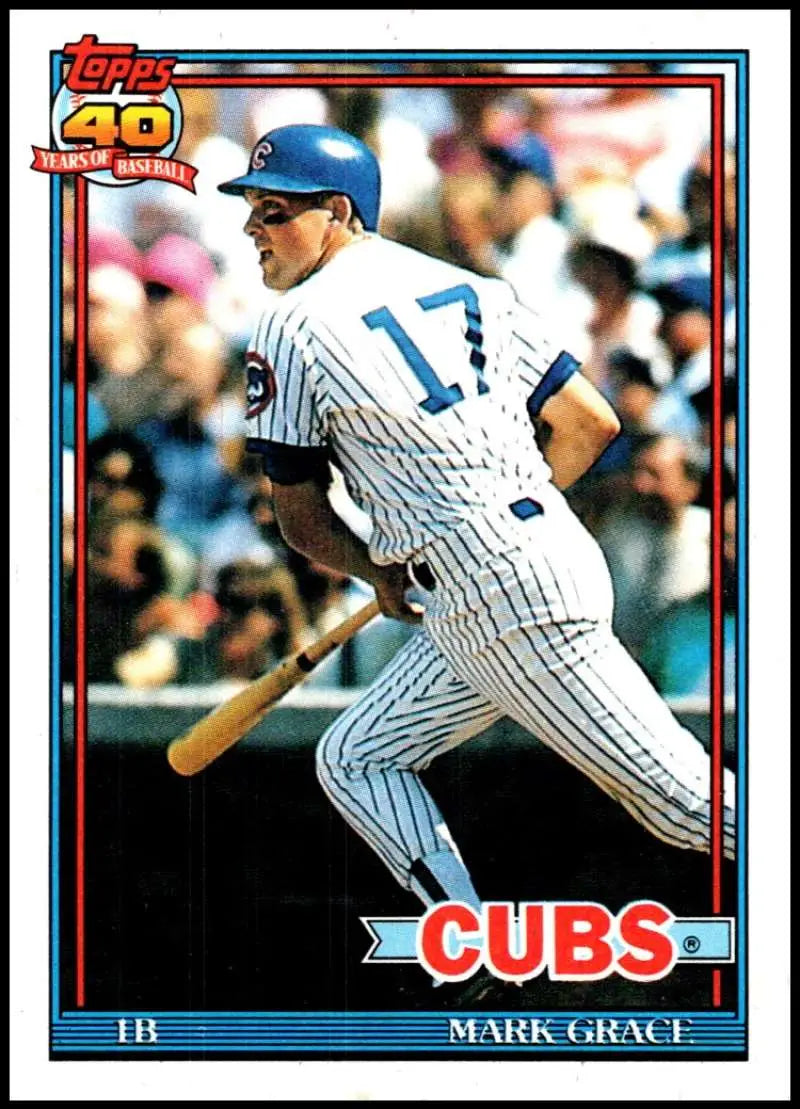 Chicago Cubs baseball card of Mark Grace in white pinstriped uniform at bat