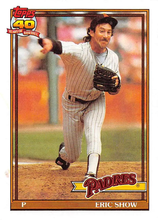 1991 Topps #613 Eric Show baseball card featuring San Diego Padres pitcher in pinstripes