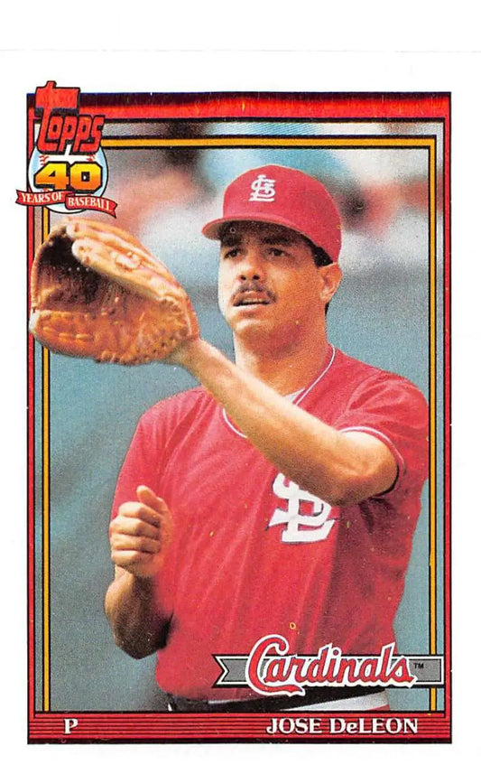 1991 Topps #711 Jose DeLeon baseball card featuring St. Louis Cardinals pitcher in red uniform