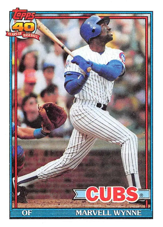 Marvell Wynne swinging bat in white pinstriped uniform on 1991 Topps baseball card