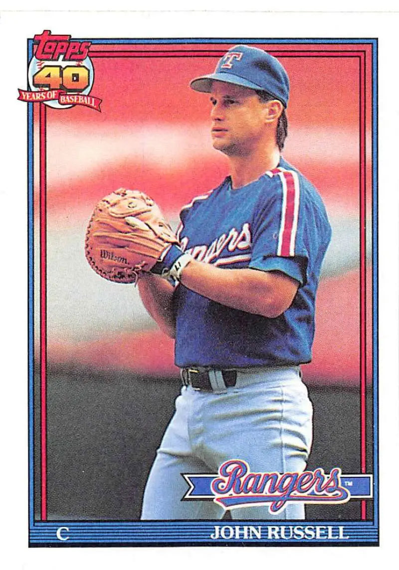 John Russell in blue uniform on 1991 Topps Texas Rangers baseball card holding glove