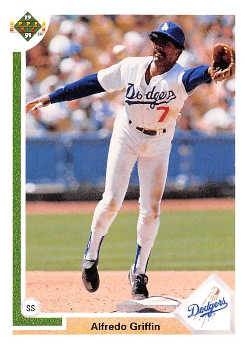 Baseball player in white Dodgers uniform making a play at shortstop for Los Angeles Dodgers