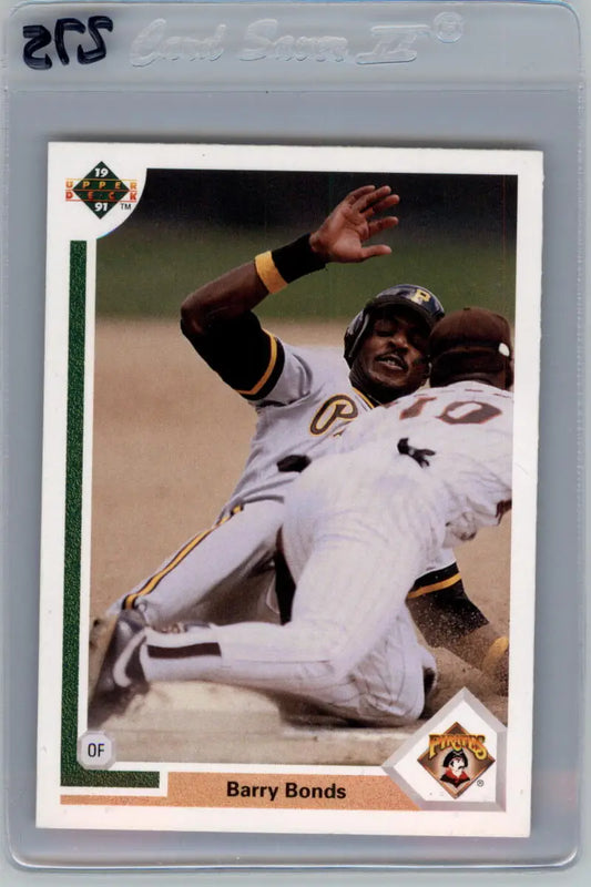 Barry Bonds sliding into base in white uniform on Pittsburgh Pirates baseball card