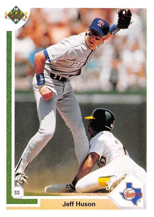 A baseball card of Jeff Huson leaping over a sliding baserunner for the Texas Rangers