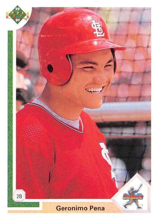 Baseball player in red St. Louis Cardinals gear smiles on Geronimo Pena Upper Deck card