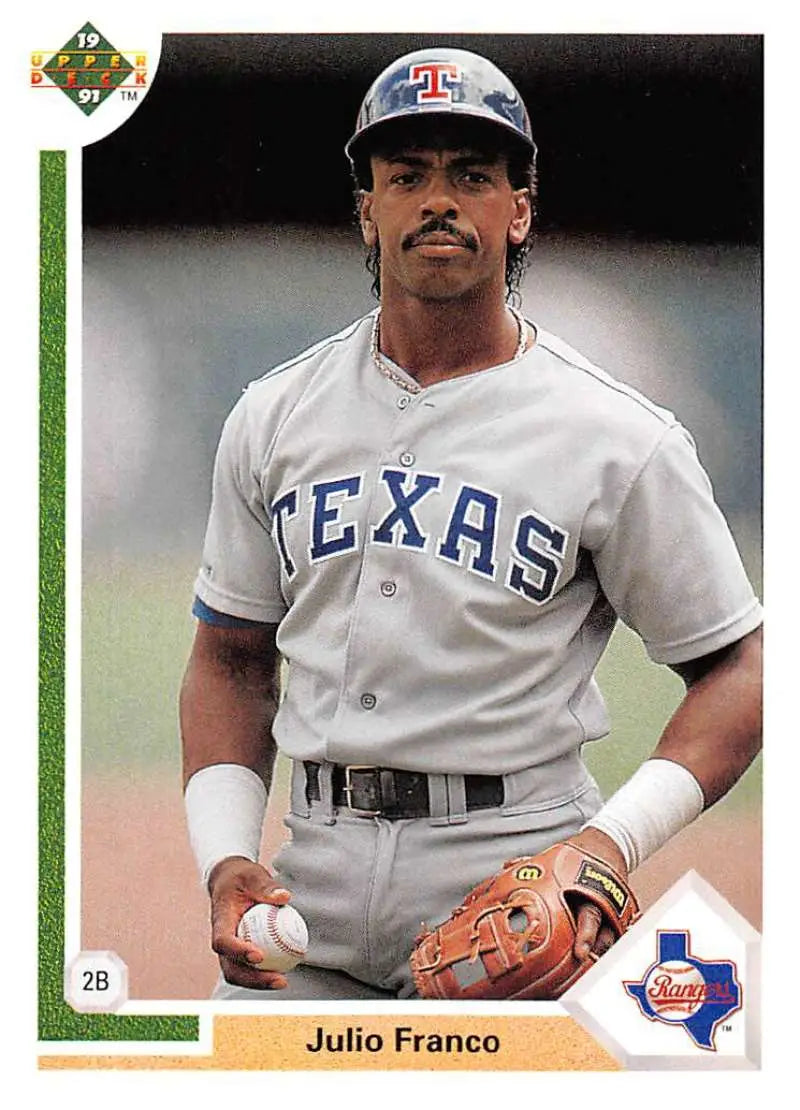 Baseball player Julio Franco in Texas Rangers uniform holding a baseball card