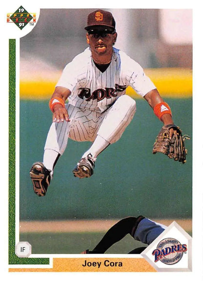 Joey Cora leaps for a catch in his San Diego Padres uniform on a baseball card