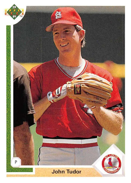 Baseball card of John Tudor in red uniform for St. Louis Cardinals holding glove