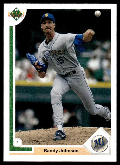 Randy Johnson delivering a pitch in gray Seattle Mariners uniform for Upper Deck card