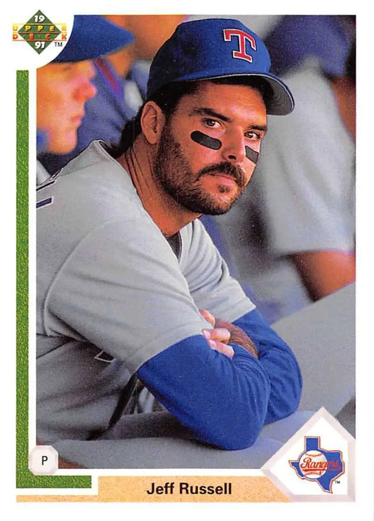 Jeff Russell Texas Rangers Baseball Card in dugout with blue cap and gray uniform