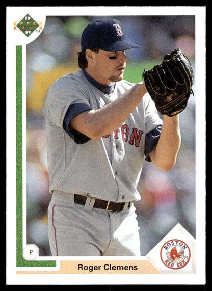 Boston Red Sox pitcher Roger Clemens in road uniform ready to throw a pitch