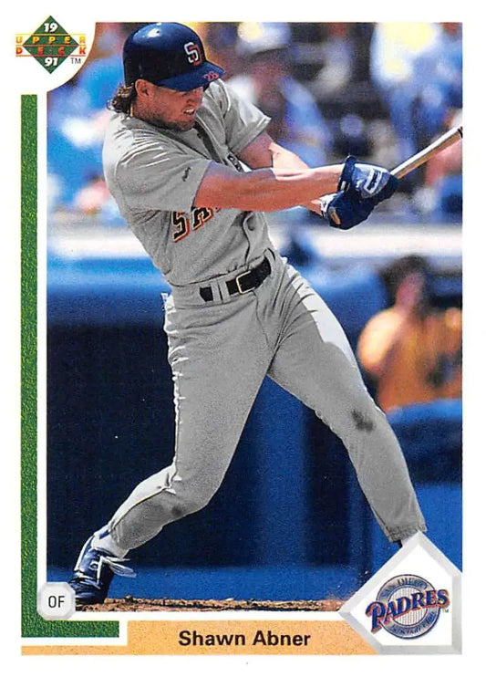 Baseball player in San Diego Padres uniform swinging bat for 1991 Shawn Abner card