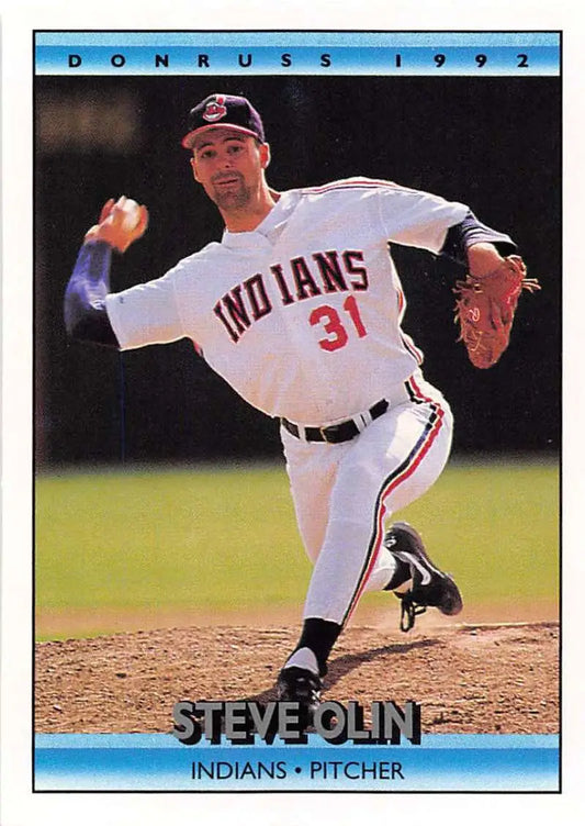 Baseball pitcher Steve Olin in Cleveland Indians uniform #31 mid-delivery on the mound