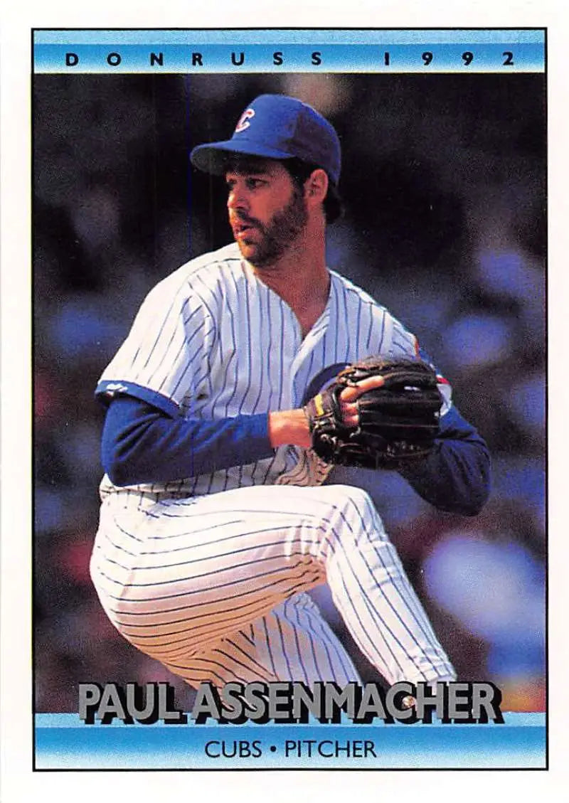 Chicago Cubs player Paul Assenmacher in pinstripes ready to pitch on a baseball card