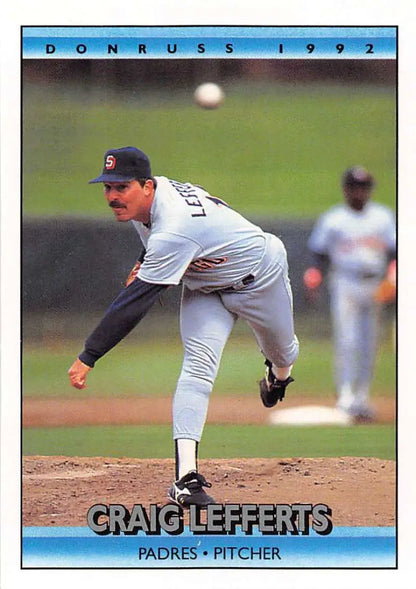 Baseball pitcher Craig Lefferts in white Padres uniform on the mound delivering a pitch