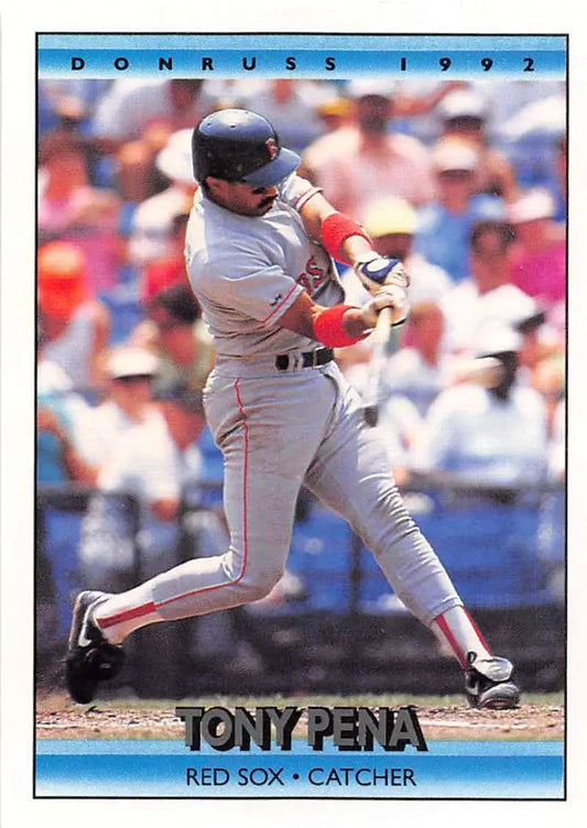 Baseball player in a Boston Red Sox uniform swinging bat, featuring Tony Pena