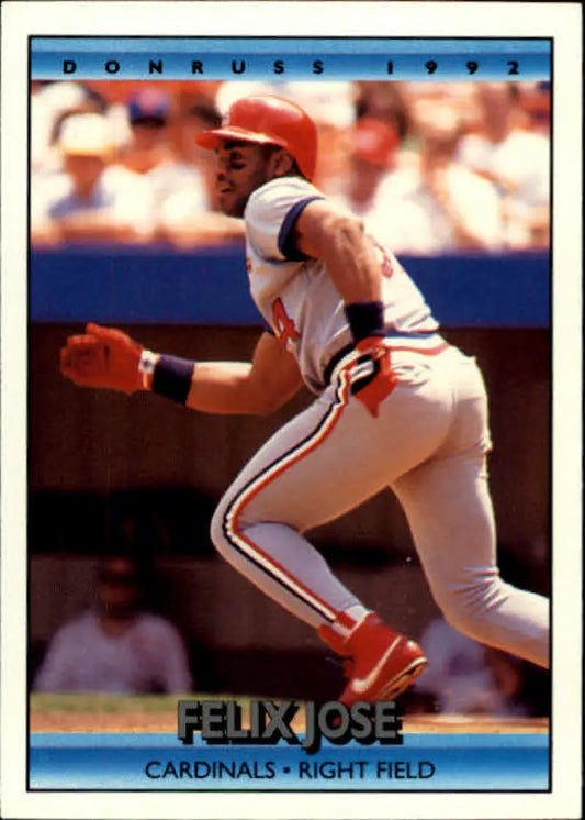 Felix Jose swings a bat in a St. Louis Cardinals uniform on a baseball card