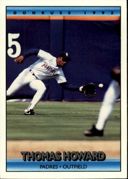 Baseball player in Padres uniform making a catch, featured on Thomas Howard baseball card