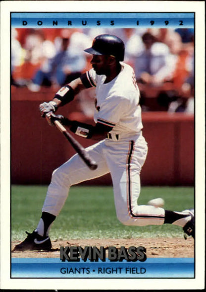 Baseball player Kevin Bass swinging a bat in San Francisco Giants uniform