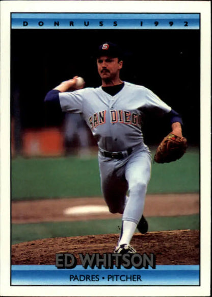 Baseball pitcher in San Diego Padres uniform mid-delivery on the mound