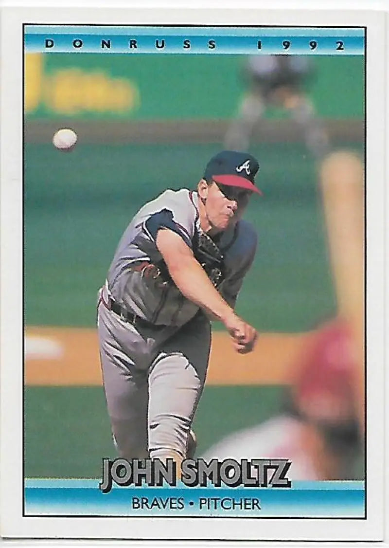 1992 Donruss #442 John Smoltz mid-delivery in gray uniform, Atlanta Braves baseball card