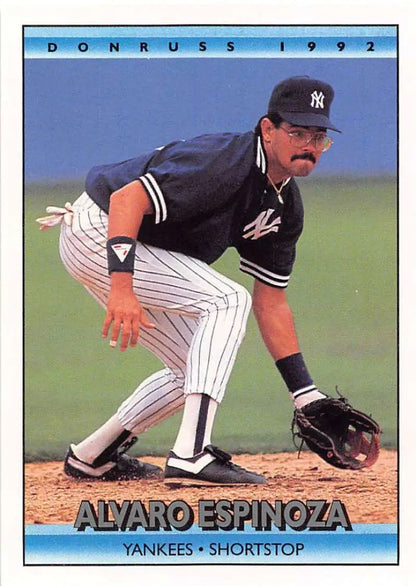 Alvaro Espinoza in New York Yankees uniform fielding, featured on a baseball card