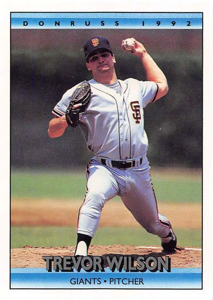 Baseball pitcher Trevor Wilson in San Francisco Giants uniform mid-delivery motion