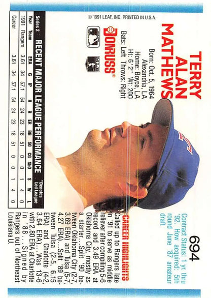 Baseball card of Terry Mathews in blue cap, Texas Rangers rookie, 1992 Donruss #694