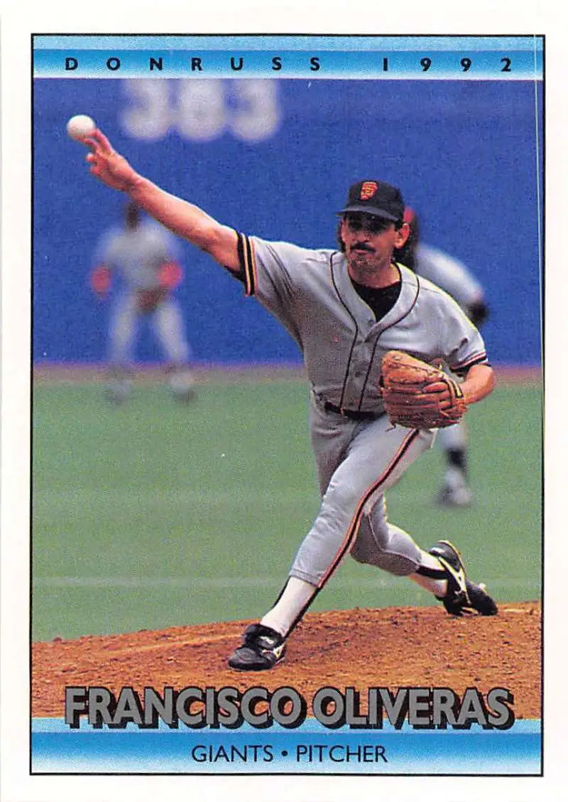 1992 Donruss #702 Francisco Oliveras mid-throwing motion San Francisco Giants baseball card