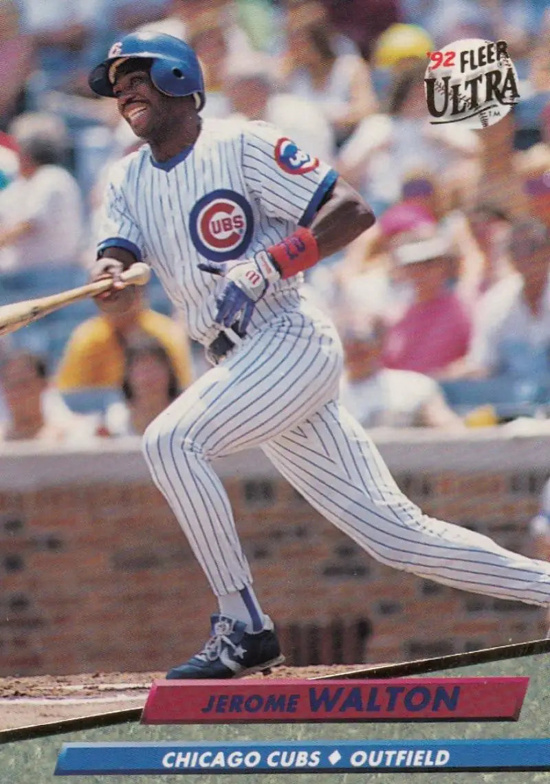 Jerome Walton swinging bat in Chicago Cubs pinstriped uniform on baseball card