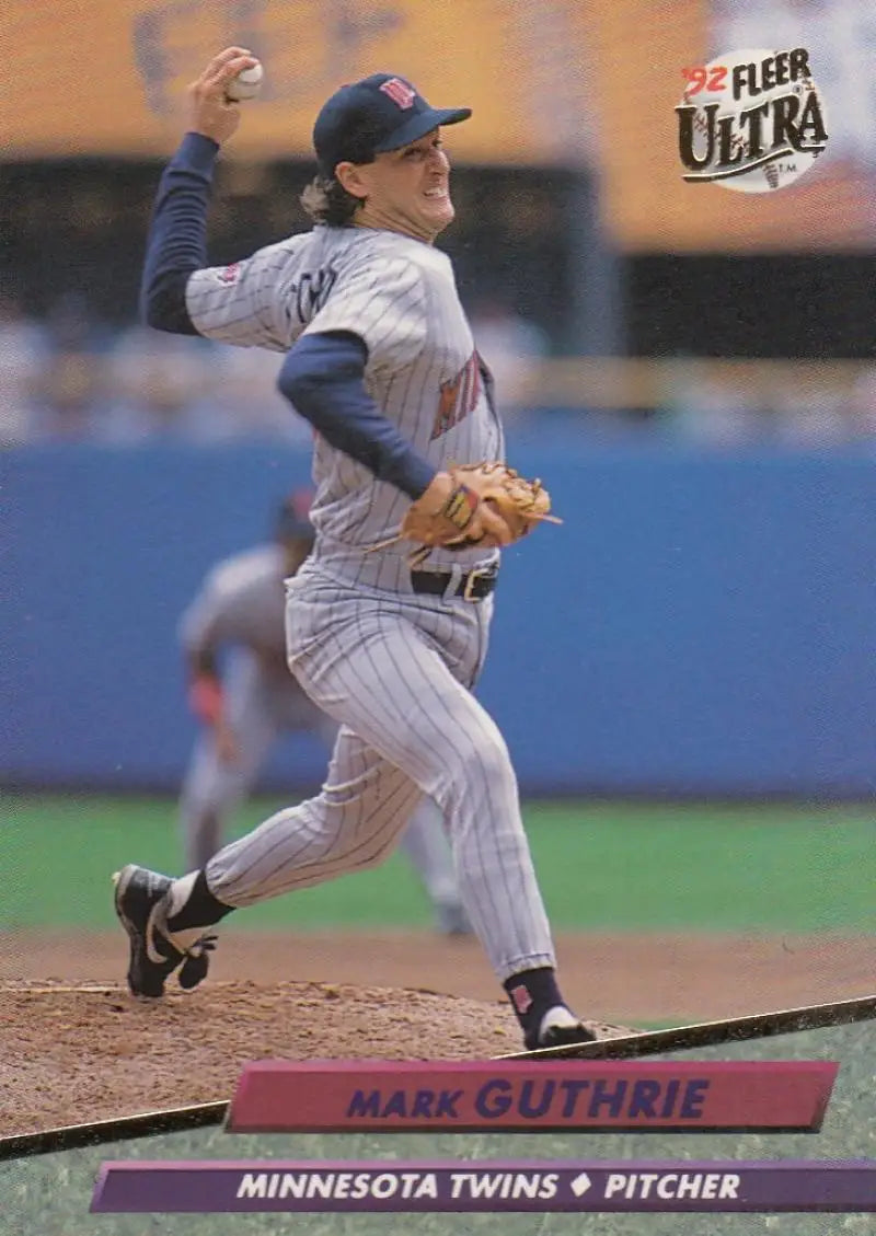 Mark Guthrie pitching for the Minnesota Twins in a gray pinstriped uniform