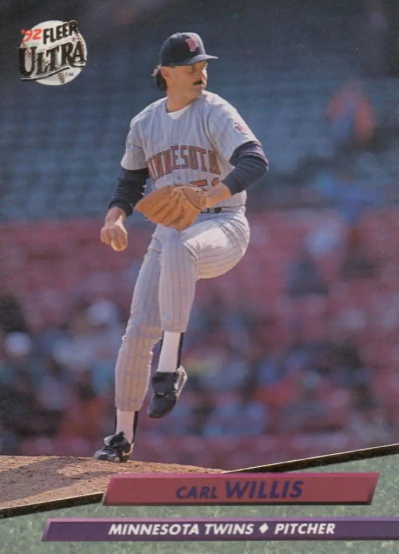 Baseball pitcher Carl Willis in Minnesota Twins uniform delivering a pitch on mound