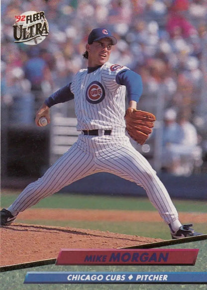 Mike Morgan delivering on the mound in Chicago Cubs pinstripes on a baseball card