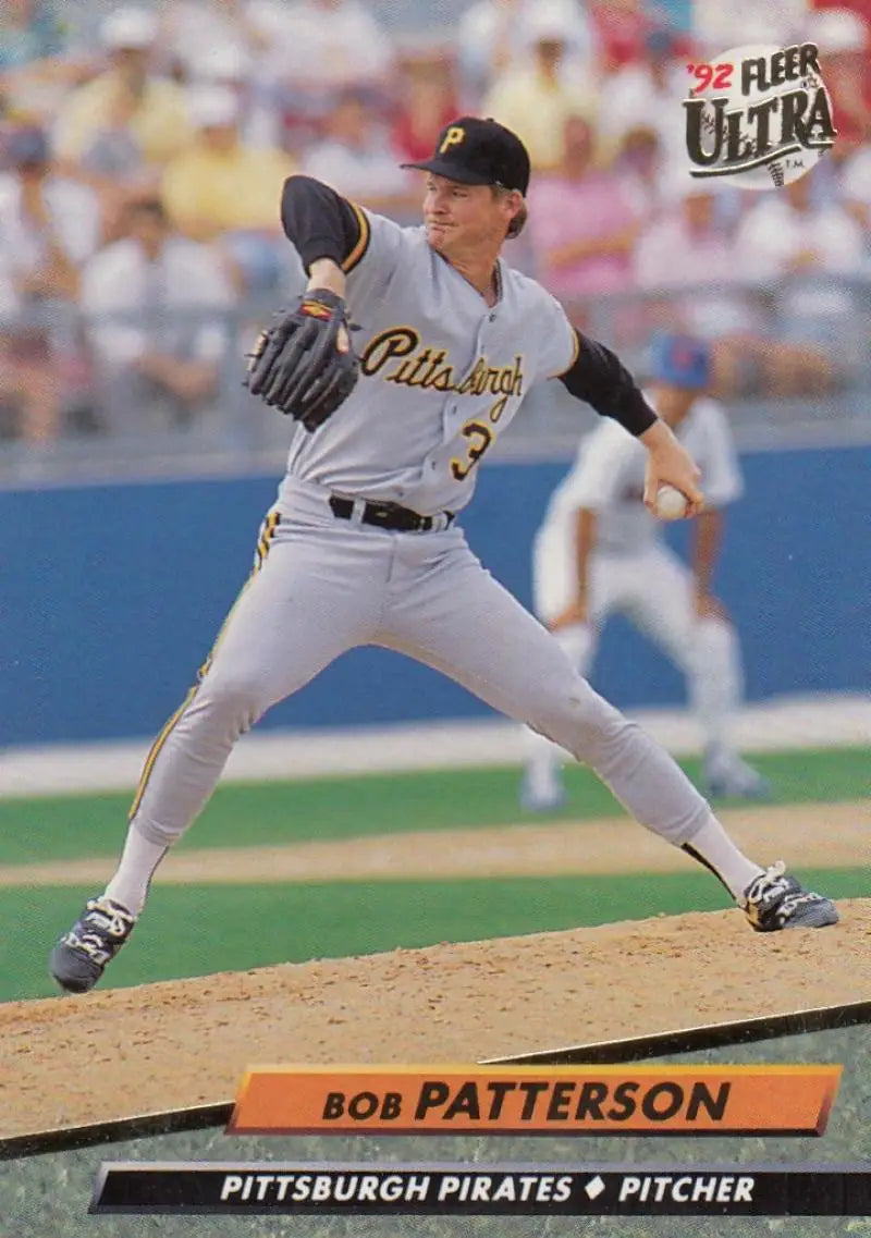 Baseball pitcher Bob Patterson in gray Pittsburgh Pirates uniform delivering a pitch