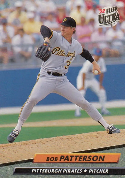 Baseball pitcher Bob Patterson in gray Pittsburgh Pirates uniform delivering a pitch