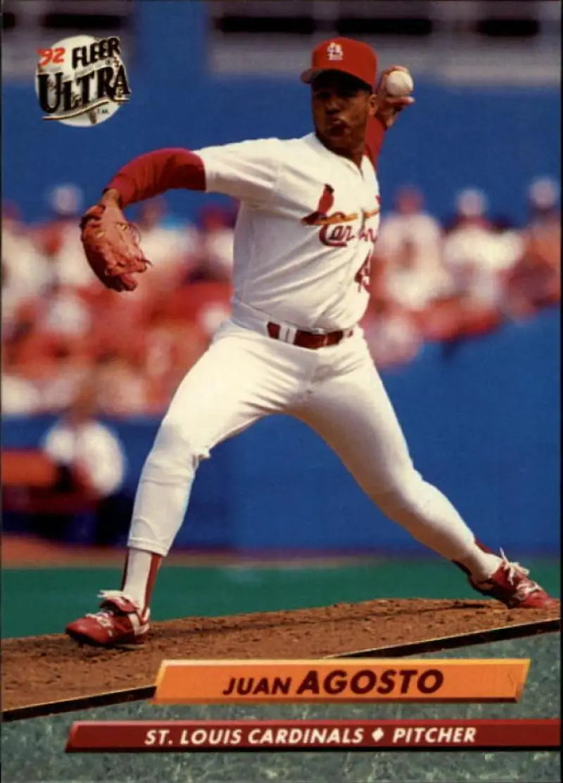 Juan Agosto pitching in a white uniform on a St. Louis Cardinals baseball card