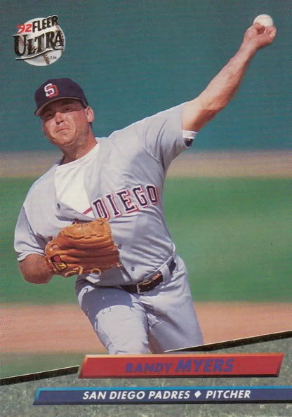 Baseball pitcher in San Diego Padres gray uniform mid-delivery during a game