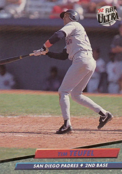 Baseball player Tim Teufel swinging bat in San Diego Padres uniform on baseball card