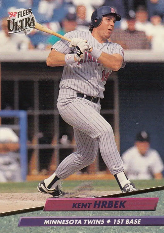 Kent Hrbek swinging a bat in Minnesota Twins pinstriped uniform baseball card image