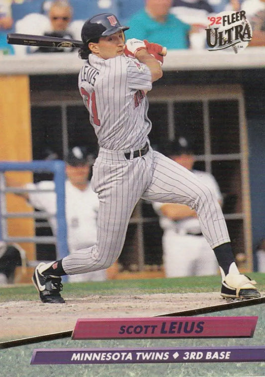 Scott Leius Minnesota Twins Baseball Card in pinstriped uniform swinging bat