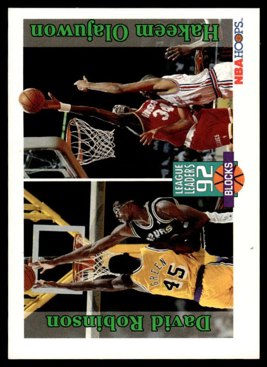 Basketball card showcasing David Robinson and Hakeem Olajuwon in action near the basket